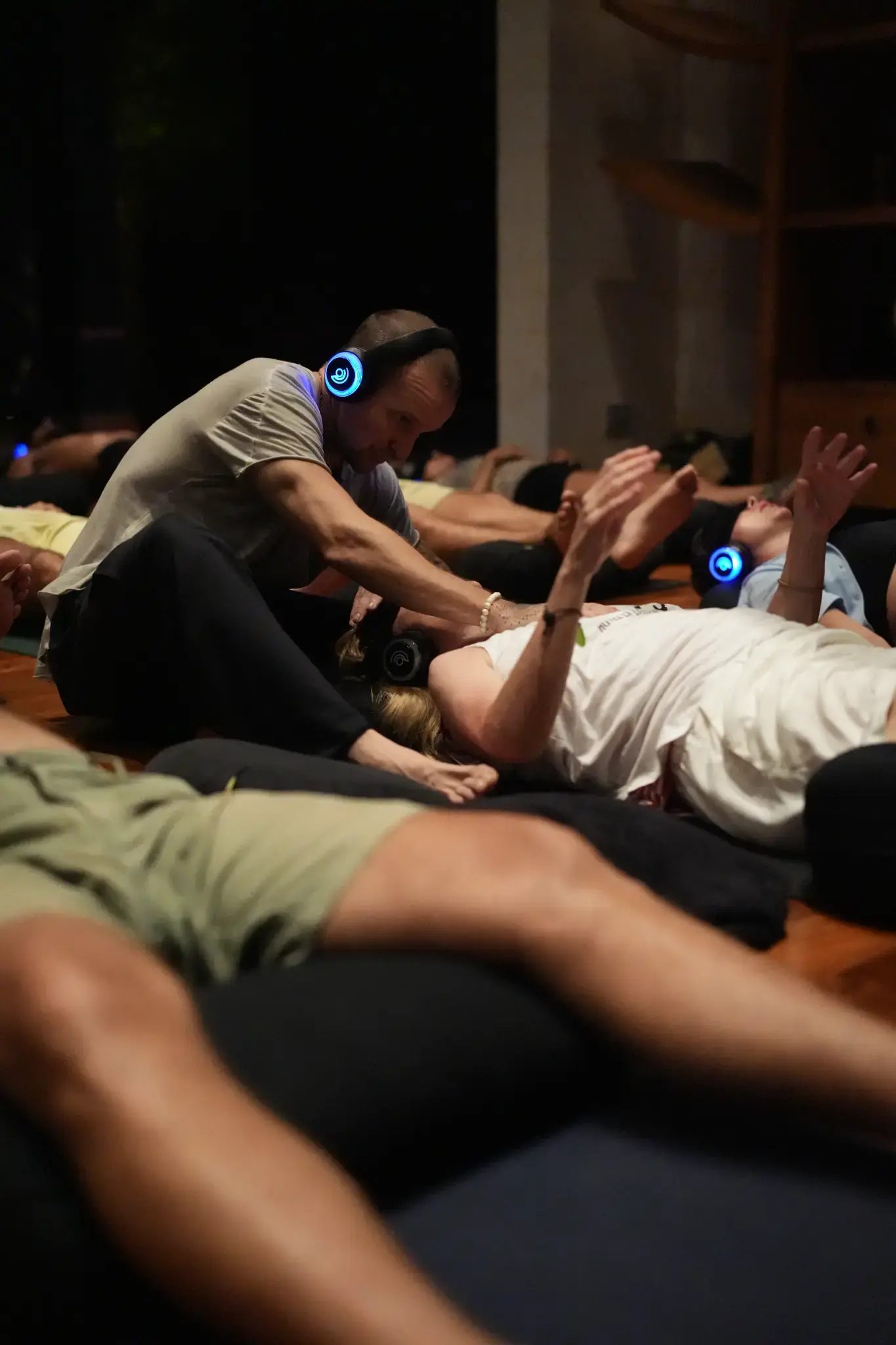 Brian Kelly supporting a participant during a 9D Breathwork session