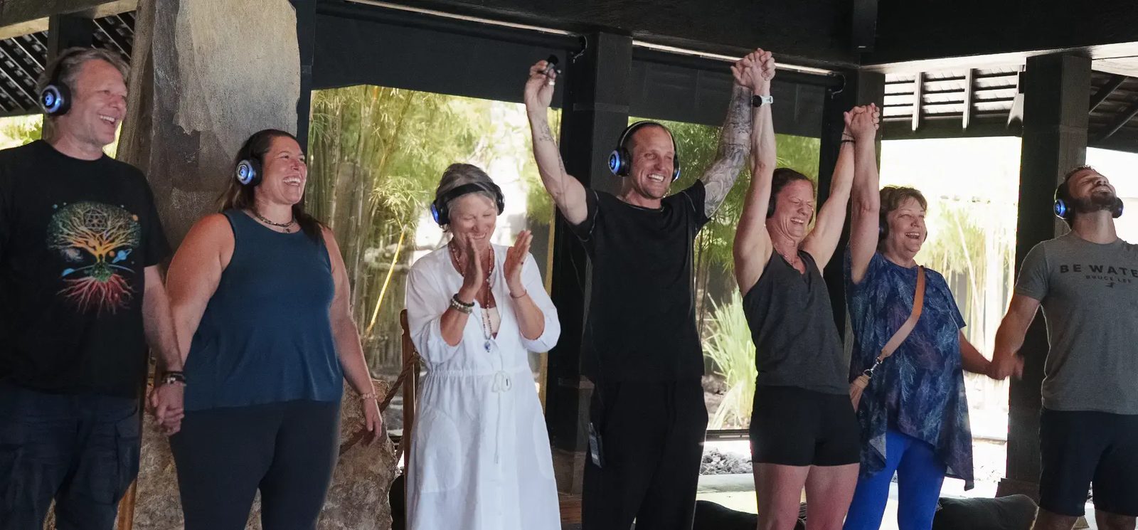 Practitioners and participants celebrating after a live 9D Breathwork session